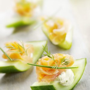 Cucumber slices topped with smoked salmon, cream, cheese, dill, and lemon zest. A great party appetizer!