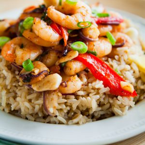 Shrimp stir-fry with rice, ginger, garlic, vegetables, chilies, onion, and lime. Great for kids or as a weekday dinner.